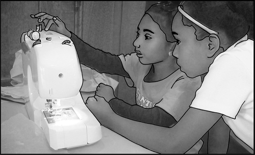 Image of girls that "tinker" with sewing machine